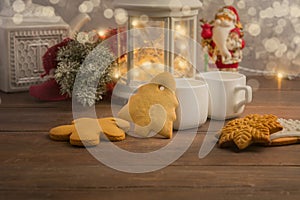 Cozy winter at home with hot drink and cookies. Christmas time with tea and garland