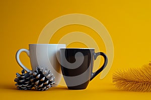 Cozy winter morning with hot drinks and pine cone photo