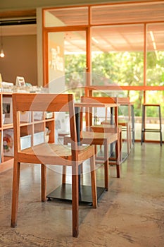 Cozy wooden interior of restaurant, copy space. Comfortable modern dining place, contemporary design background,