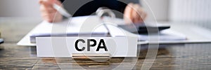 CPA Name Plate On The Table In The Office