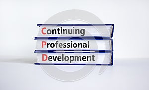 CPD, continuing professional development symbol. Books with words CPD, continuing professional development on beautiful white photo