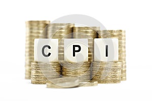 CPI (Consumer Price Index) on Coin Stacks Isolated White Backgro