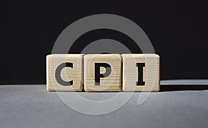 CPI - Consumer Price Index symbol. Concept word CPI on wooden cubes. Beautiful grey background. Business and CPI concept. Copy