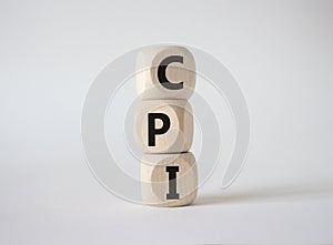CPI - Consumer Price Index symbol. Concept word CPI on wooden cubes. Beautiful white background. Business and CPI concept. Copy