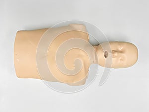 CPR dummy on white background for first aid and cardiopulmonary resuscitation training