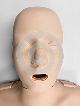 CPR dummy on white background for first aid and cardiopulmonary resuscitation training