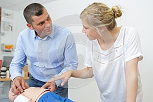 cpr training on baby dummy indoors