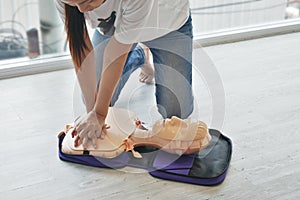 Cpr training. close-up of trainee`s hand pump on chest of dummy on CPR First Aid Training course for primary safe life.