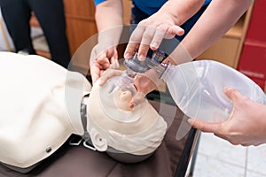 CPR training with CPR doll and Am-bu bag for ventilation resuscitation.