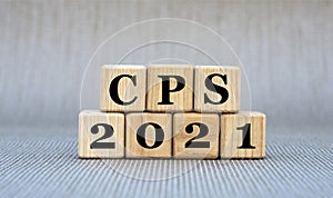 CPS 2021 - word on wooden cubes on a gray background