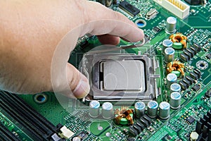 CPU in hand before installation into the motherboard