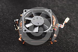 CPU heat sinker from a PC. Copper heatsinker with a fan for cool