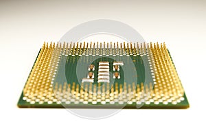 CPU. An old processor of 2001 release P III-800 on a white background. Focus in the background.