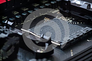CPU socket and processor on the motherboard. Focus on the motherboard. Toned image