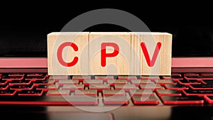 CPV cost per view. Letters of the word CPV on wooden blocks isolated on the laptop keyboard photo