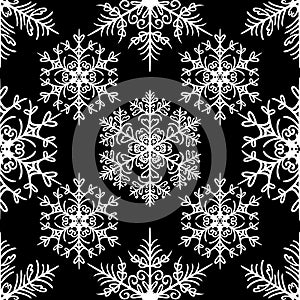 Simple seamless pattern with snowflakes on black background