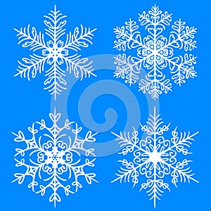 Snowflake winter set. Vector silhouettes on blue background
