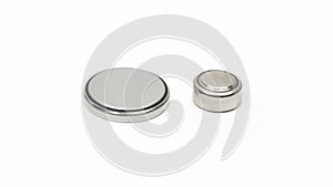 CR2032 and LR44 button cell batteries side by side on a white background.