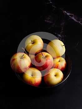 Crab apples on a black background