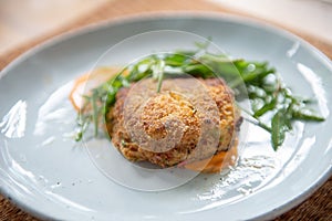 Crab Cake Dinner Recipe: Savor the Delight of Succulent Crab Cakes, Served with a Refreshing Rocket Salad
