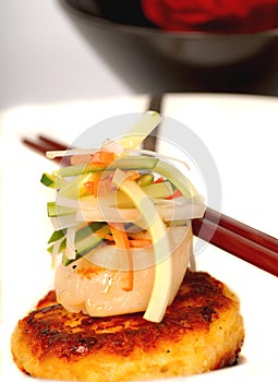 Crab cake and scallop appetizer with vegetables