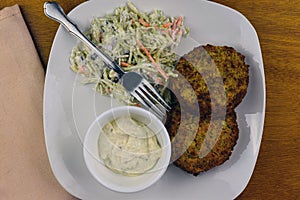 Crab cakes with cole slaw  and tarter sauce