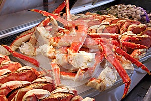 Crab and clams on ice at a fish market