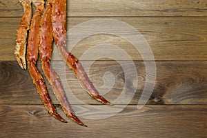 Crab claw on wooden background