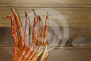 Crab claw on wooden background