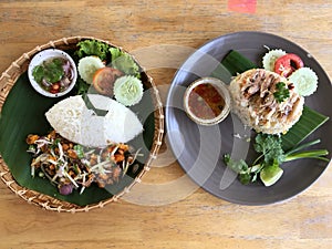 Crab egg salad eaten with hot rice, beautifully arranged in a woven basket plate.