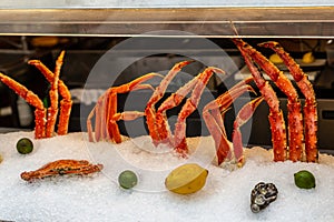 Crab legs, tentacles standing in ice to preserve the freshness of the counter in the fish restaurant
