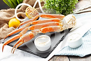 Crab legs. On a wooden table.