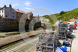 Crab and lobster pots on the quayside in Staithes harbour