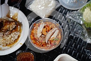 Crab meat chili paste on a black rattan table photo