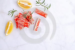 Crab meat sticks with lemon and rosemary