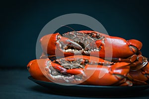 Crab seafood plate with, fresh crab on black plate, crab cooking food boiled or steamed crab red in the restaurant