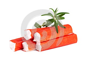 Crab stick isolated on white background. Imitation crab meat with rosemary sprig. Fish product