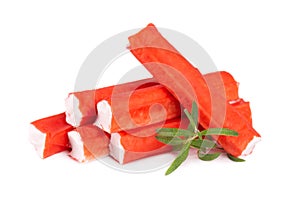 Crab stick isolated on white background. Imitation crab meat with rosemary sprig. Fish product