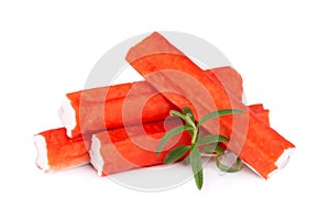 Crab stick isolated on white background. Imitation crab meat with rosemary sprig. Fish product