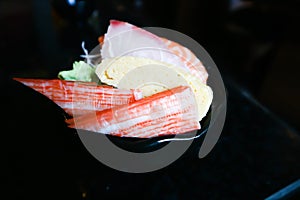 Crab stick or Kanikama , steamed egg and raw fish or sashimi