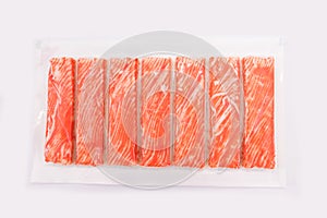 Crab sticks in packaging on a white