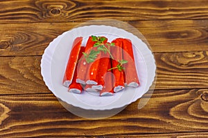 Crab sticks on wooden table