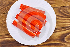 Crab sticks on wooden table