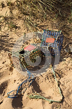 Crab traps at the beach washed out by the tide