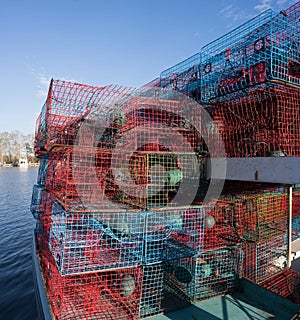 Crab traps stacked on a fishing boat photo