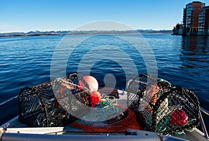 Crabpots loaded on Norway Motorboat to fish in the fjords during the winter time. Rogaland Norway