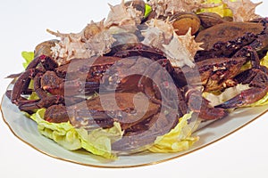 Crabs, snails and clams before cooking, dish over white background