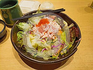 Crabstick fresh salad with tobiko and sesame dressing