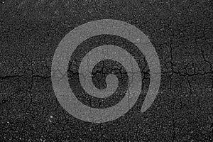 Crack asphalt road background.