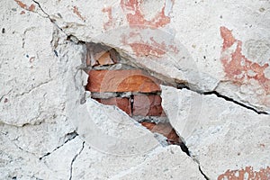 The crack in the brick house. Textured stone white wall